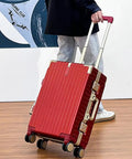 Ultralight Aluminum Frame Carry On Luggage with Smooth Spinner Wheels Red 22 Inch Suitcase being pulled by person