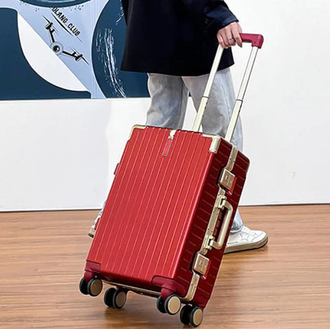 Ultralight Aluminum Frame Carry On Luggage with Smooth Spinner Wheels Red 22 Inch Suitcase being pulled by person