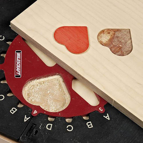 Design And Inlay Router Template Jig Kit For DIY Woodworking with 25 Pattern Ideas showing heart shape cutout in wood