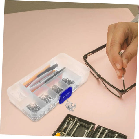 Close-up of eyeglass repair kit with screws, screwdriver, and tweezers, demonstrating use for quick fixes and DIY repairs.