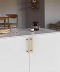 Installed Ten Pack 5 Inch Cabinet Handles With Champagne Bronze Finish For Kitchen Cupboards and Wardrobes on white cabinetry.