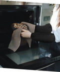 Woman using Six Pairs Oil Resistant Arm Sleeves Long Kitchen Cooking Oversleeves With Grippy Elastic Bands to pull food from oven.