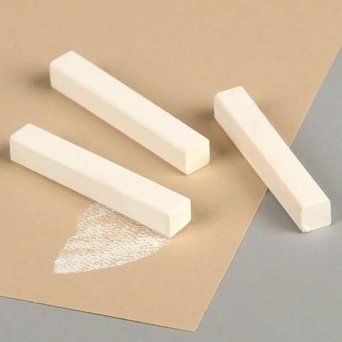 Three Alphacolor Soft Square Pastels from the White 12 Pack on paper surface, ideal for blending on paper, fabric, and ceramics.