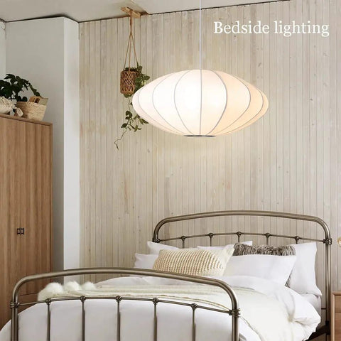 Italian Silkworm Cocoon Pendant Light With White Faux Silk Drum Shade in modern bedroom setup, handcrafted lantern
