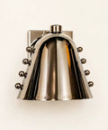 Modern Adjustable Chrome Wall Sconce Polished Metal E26. Polished metal spotlight wall lamp with round accents.