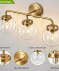 Three Light Vanity Wall Sconce Over Mirror In Matte Gold Finish With Transparent Glass Ball Shade, showcasing details