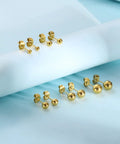 Ball Stud Earrings For Women And Men 316L Stainless Steel Hypoallergenic Jewelry Set Lead Free And Nickel Free 3 To 7mm Sizes 5 Pairs Everyday Lightweight Comfort, gold-tone pairs on blue backdrop