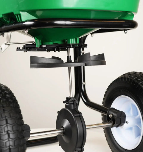 Close-up of Walk-Behind Broadcast Spreader for Fertilizer, Grass Seed and Salt, 80 Lb Hopper, Spider Agitator, Pneumatic Tires