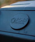 Close-up of 37 Gallon Plastic Single Chamber Rotating Tumbling Compost Bin With Elevated Stand showing front panel logo