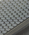 Close-up of Coin-Grip Grit Surface Rubber Stair Tread Mats 10 Inch By 36 Inch, 6 Pack, showcasing textured surface detail.