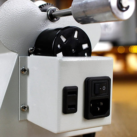 Coffee roaster machine close-up showing power switch and motor connection for Crank Up Your Home Brewing Setup With This Solid Coffee Roaster Machine Featuring A Continuous Rotating Stainless Steel Drum Precise Heat Dials And Flexible Capacity Options For Fresh Beans And Whole Grains That Never Miss A Beat.