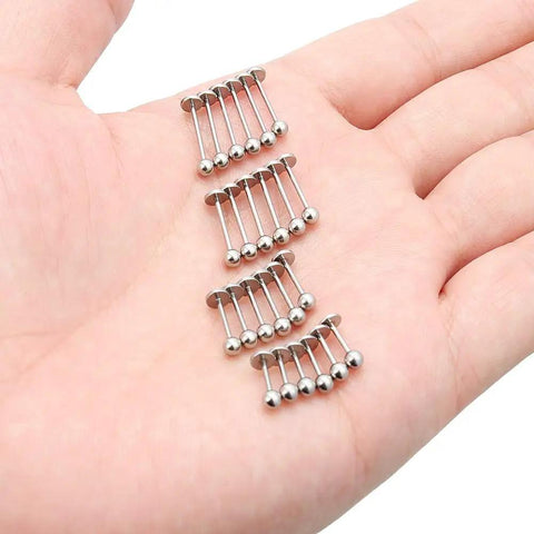 Dope 24 Piece Labret Barbell Set For Lip Helix Tragus And Cartilage Piercings In Surgical Steel Hypoallergenic 20G Includes 6Mm 8Mm 10Mm And 12Mm Sizes With Velvet Gift Bag Great Gift For Women And Men. 24 surgical steel labret barbells in assorted lengths on a hand