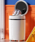 Triple Threat Semi Auto Mini Washer Dryer For Sneakers And Workout Gear with shoes inside, compact design, placed in a stylish room.