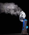 New Classic Handheld Personal Steam Inhaler Vaporizer And Humidifier emits steam in dark background scene