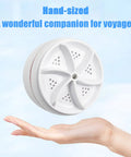 Hella Compact Mini Portable USB Washing Machine For Laundry And Dishes Ultrasonic Sink Turbo Washer hand-sized in palm.