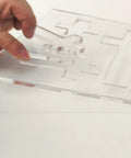 Hella Durable Cross Router Template For Woodworking And DIY Creations Solid Clear Acrylic Ribbon Crosses Inlay Jig With Three Built In Sizes For Zero Stress Layouts, hand placing acrylic piece.