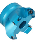 CNC lathe face mill head, blue aluminum alloy with mounting bore and screws, close-up view
