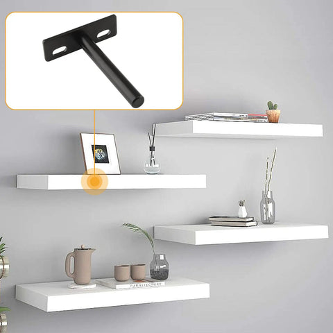 Rock Solid Four Inch Floating Shelf Brackets Set Of Four In Matte Black Featuring Invisible Mounting And Straight Up Easy Wall Install With Heavy Duty Industrial Steel on a wall with white floating shelves.