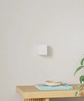 Modern Cube Wall Sconces With Adjustable Cable Distance And Smart RGBic LED Fixture That Hooks Up To Alexa, mounted on wall.