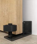 Sliding Barn Door Floor Guide And Wall Mounted Hardware with Flush Bottom Adjustable Stay Rollers fitting a wooden door.