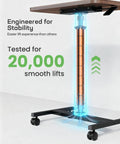 Pneumatic lift mechanism of Mobile Standing Desk With Wide Height Range From 28.5 To 46.1 Inches on lockable wheels, walnut finish.