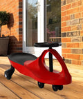 Red Wiggle Car Ride On Toy For Ages 3 And Up No Batteries Gears Or Pedals Just Twist Wiggle And Go on wooden deck