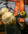 Worker holds Six In One Lineman's Ratcheting Wrench With Bolt Through Design And Bright Yellow Socket for Utility Pole Hardware