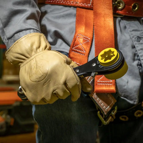Worker holds Six In One Lineman's Ratcheting Wrench With Bolt Through Design And Bright Yellow Socket for Utility Pole Hardware