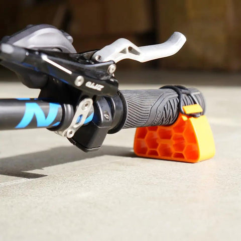 Clip On Bike Handlebar Stand Set For Inverted Parking And Bike Maintenance, protects levers and shifters, orange color
