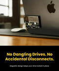 All In One Portable 1TB SSD With Active Cooling Fan And Built In 4 Port Hub HDMI 2 1 attached to MacBook, magnetic design