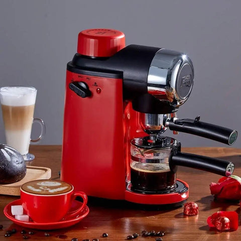 5 Bar High Pressure Coffee Machine With Foam Function, compact red design, on a table with lattes and accessories, front view.