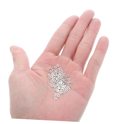 Hand holding Rimless Eyeglasses Repair Washers Kit With 200 Pieces Of Metal Flat Gaskets For Quick Frame Tightening