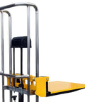 Pro Grade Heavy Duty Hydraulic Pallet Jack Stacker With Removable Cover Plate showing side view of steel frame and yellow platform.