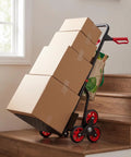 Foldable Stair Climbing Hand Truck With Six Wheel Set For Couriers And Storage Rooms Durable Carbon Steel Frame Compact Fold On The Go Portable Transport Cart For Steps And Curbs Easy Storage And Heavy Duty Hauling with boxes on wooden stairs