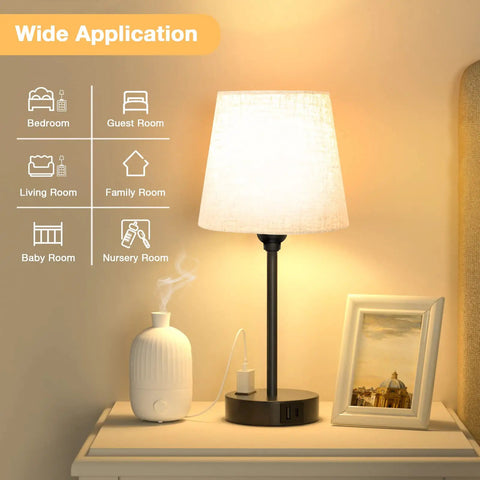Set Of 2 Dimmable Touch Bedside Lamps With USB C And AC Outlet Charging Station on nightstand, vase and photo frame nearby.