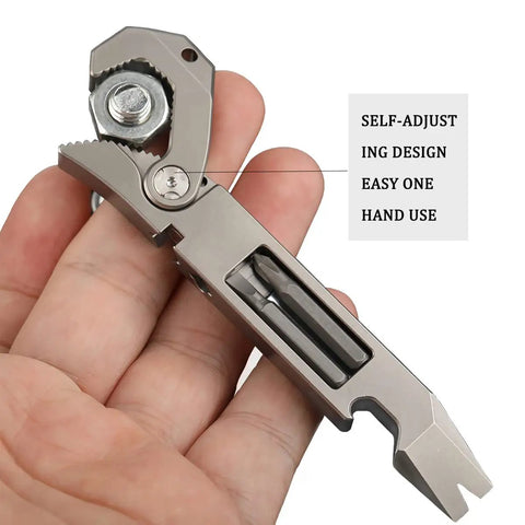 Hand holding EDC Titanium Multitool Pry Bar with Pocket Clip Mighty Bar Packs Wrench, Screwdriver, and features label