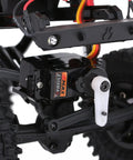 Close-up of Two Pack Emax ES08MAII 12g Analog RC Servo installed in 1/24 scale RC crawler showcasing high torque metal gear.