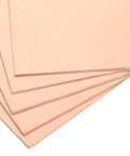 Stack of Copper Clad FR4 Double Sided Prototyping PCB Boards For Circuits Projects Pack Of 10, showcasing smooth copper surfaces.