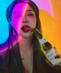 Sunset Lamp Projector With Remote 13 Color Multicolor Night Light effects on a person holding a drink, creating vibrant shadows.