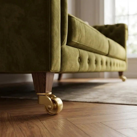 Heavy Duty Brass Casters Four Pack Double Ball Bearing Furniture Wheels Rust Resistant on sofa leg in living room.