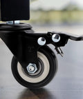 Side view of a heavy duty caster with dual locking mechanism and 360 degree swivel, part of Dual Locking Casters Set Of Four Heavy Duty 330 Lbs Capacity With Five Sixteenth Inch Stem Diameter And One Inch Stem Length 360 Degree Swivel Wheels For Furniture Wire Shelving And Carts Secure Locking Mechanism Fits Standard American Sizing.