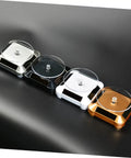 Four sleek solar powered rotating jewelry display stands in silver, black, white, and gold, showcasing no batteries needed design.