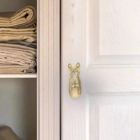 Real Deal Brass Animal Head Cabinet Knobs With Sweet Golden Finish Durable Drawer Pulls For Wardrobes Cupboards Easy Install Furniture Setup on a wardrobe.
