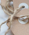 Close-up of 1000 Ft 3Mm Natural Jute Twine Rope Heavy Duty Garden String tied on brown paper tags