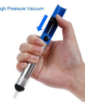 Hand holding solder sucker from 7 Piece Solder Aid Tool Kit For DIY PCB Desoldering And Circuit Board Repair Includes Solder Sucker Desoldering Pen Tin Lead Tips Cleaning Brushes And Replacement Parts For Precise Welding And Cleanup