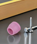 Heavy Duty Plasma Cutter Torch Tip Nozzle Consumables Kit For Handheld Welding includes pink nozzle and metal screws on surface.