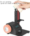 Close-up of a hand using the Multifunctional Electric Belt Sander Grinder With 10 Belts for fillet arc grinding on a workbench.