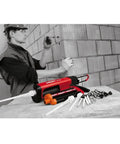 Black HIT-CB 500 Adhesive Anchor Cartridge Holder for concrete and masonry, shown on worksite with accessories and worker