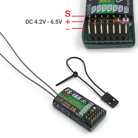 Close-up of Six Channel 2.4GHz AFHDS 2A RC Receiver with wire connectors and labeled voltage for fixed wing glider quadcopter use