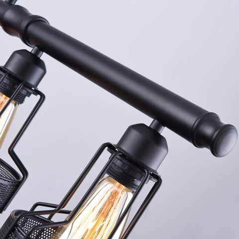 Detailed view of Farmhouse Pendant Lights Black 5 Light Linear Chandelier For Kitchen Island And Dining Room Adjustable Cord Up To 59 Inches Sloped Ceiling Compatible UL Listed Cables And Sockets Bulbs Not Included showing black metal frame and bulb sockets.